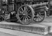 1935: Children gather around a cannon in Dorrence Brooks Square, the first public square named after an African-American soldier, Civil War veteran and Harlem native Dorrence Brooks.